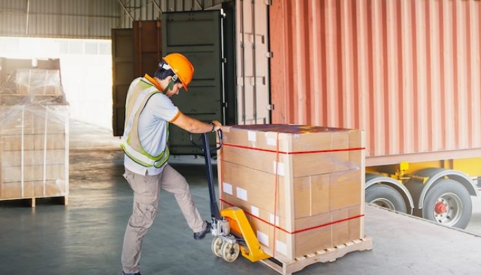 Warehouse,Workers,Loading,A,Package,Pallets,At,Warehouse.,Container,Shipping.