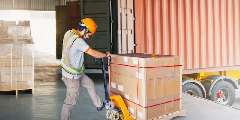 Warehouse,Workers,Loading,A,Package,Pallets,At,Warehouse.,Container,Shipping.