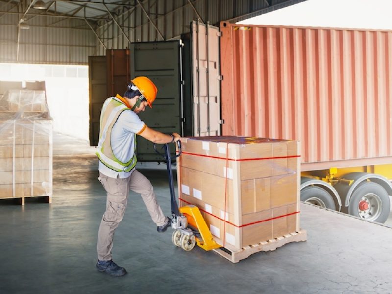 Warehouse,Workers,Loading,A,Package,Pallets,At,Warehouse.,Container,Shipping.